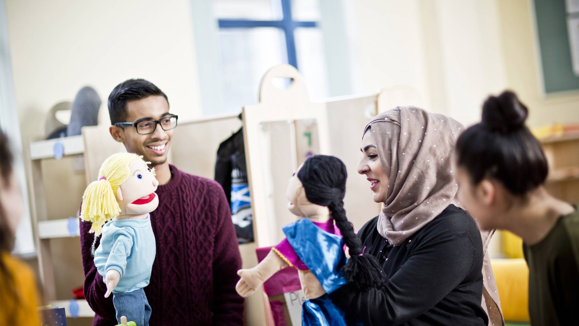 SEPD Early Years room in Lockside with students doing puppet activity