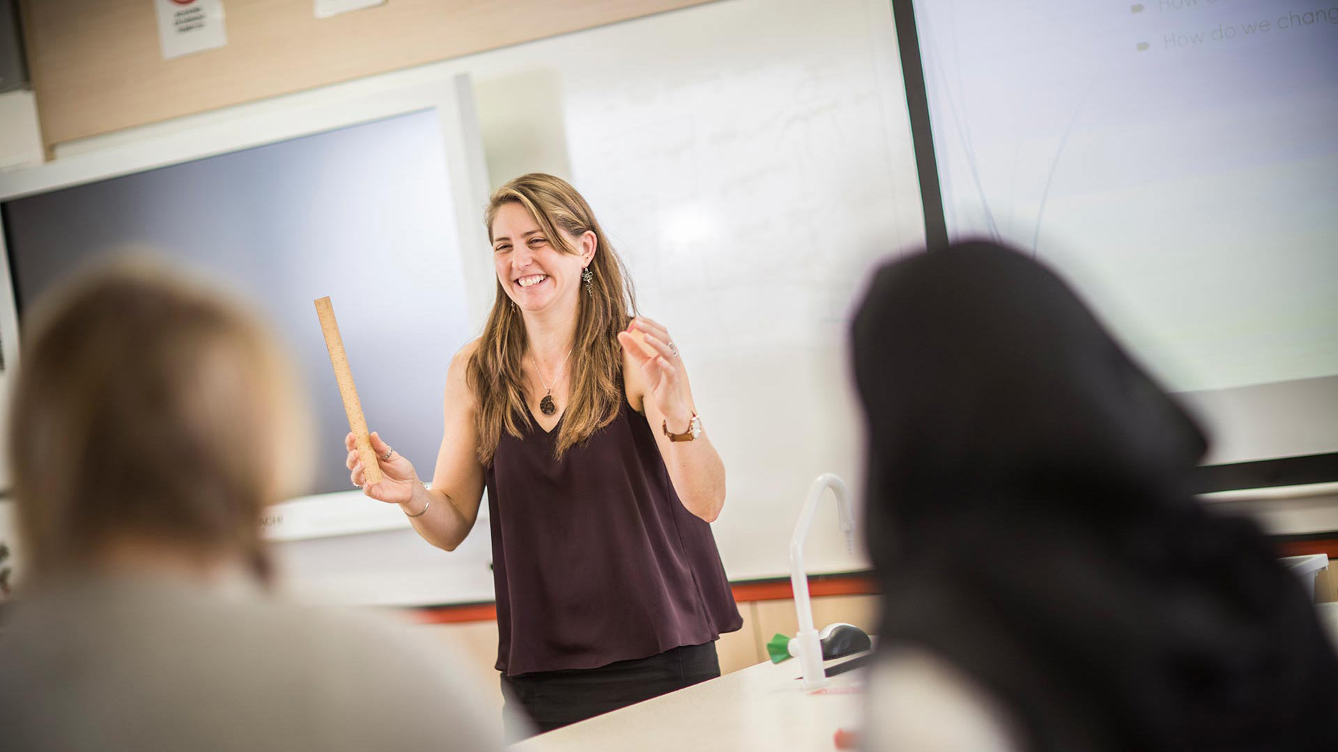 Guest lecturer teaching students in specialist classroom
