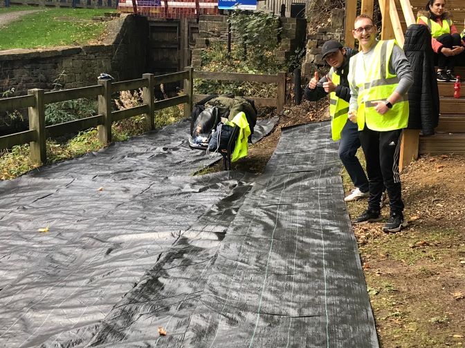 Kirklees Students-laying tarpaulin1