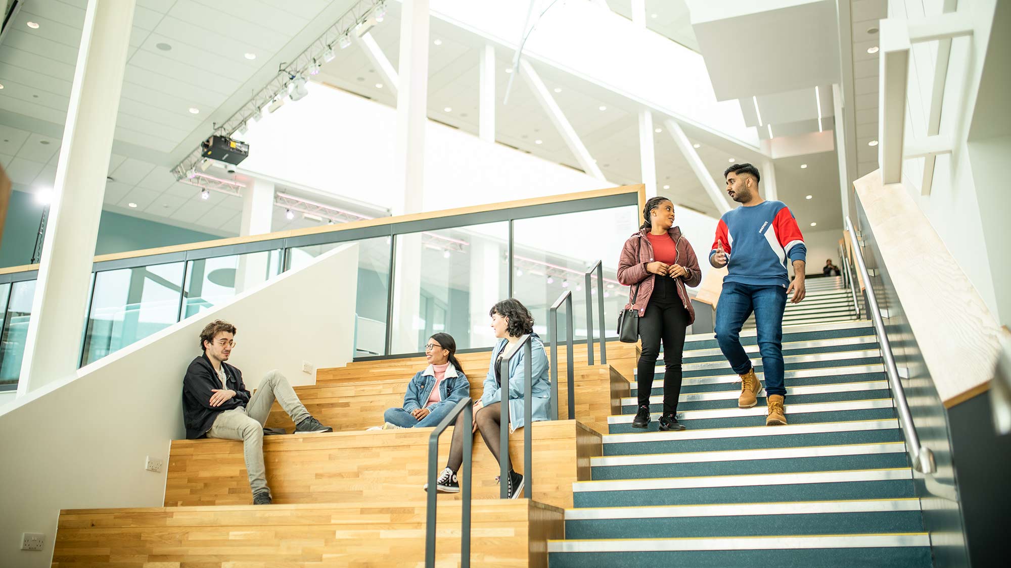 Students stand on the communal staircase in Barbara Hepworth Building 