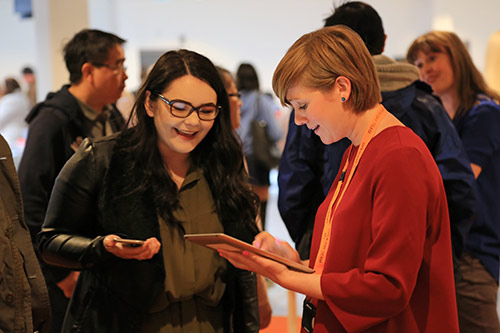 A postgraduate applicant being helped by on of our PG fair assistants
