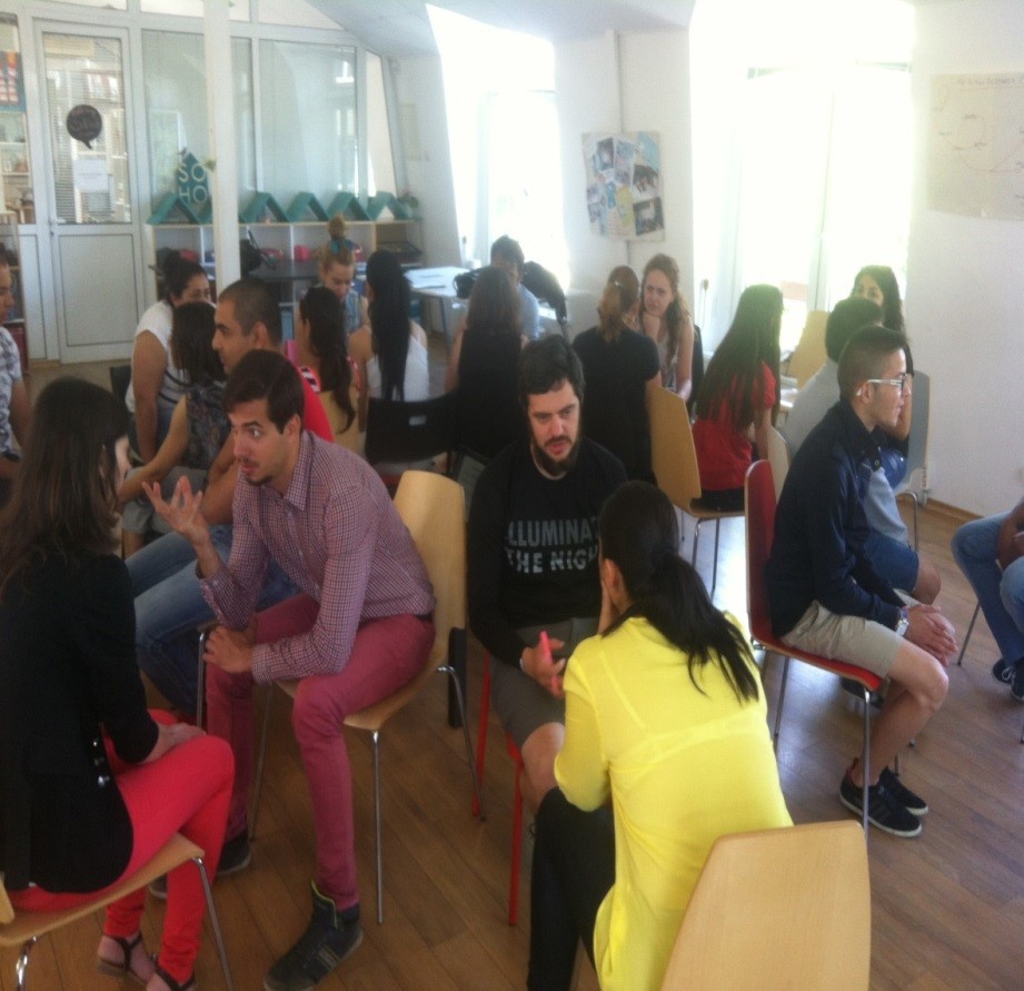 Young adults talking in pairs as part of a workshop